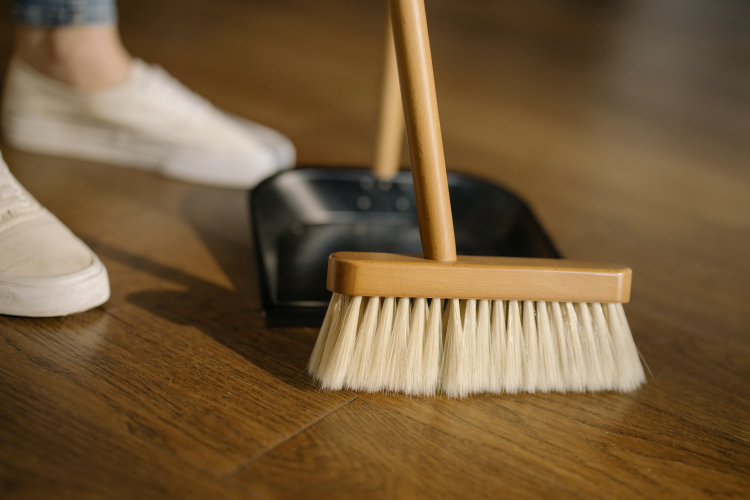 broom and dust pan sweeping