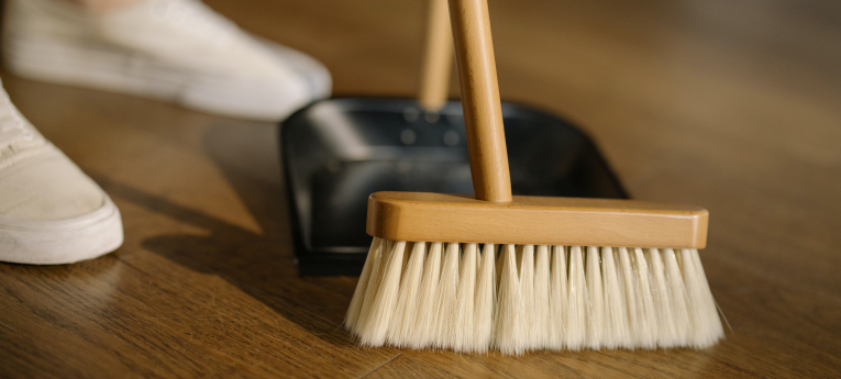 broom and dust pan sweeping